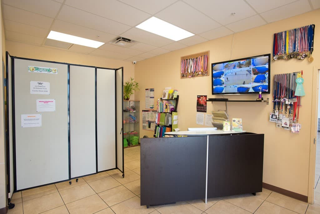 Rhythmic Art reception desk inside the Dania Beach facility